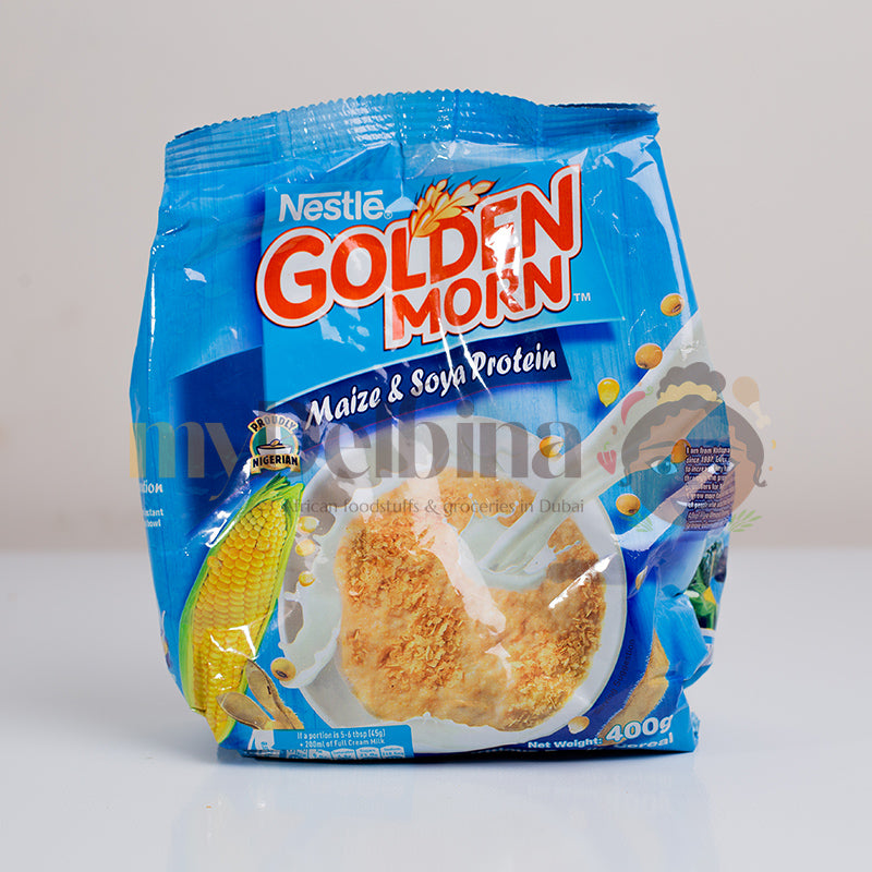 A pack of Nestle Golden Morn cereal, featuring maize and soya protein, in a blue and white packaging with an illustration of the cereal and a cornucopia of maize.